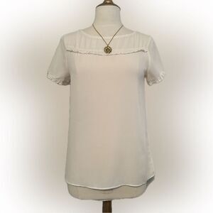 Loft cream colored ruffle-top mixed-material blouse!